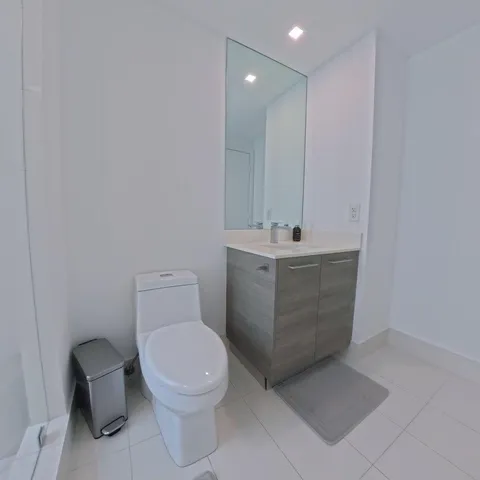 a bathroom with a tub a sink and a shower