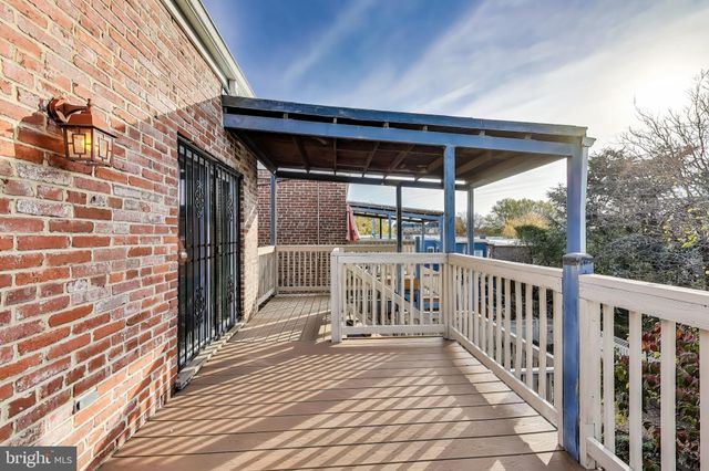 a view of a deck with wooden floor and outdoor space
