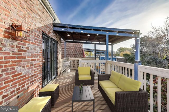 a view of sitting area with furniture and wooden deck