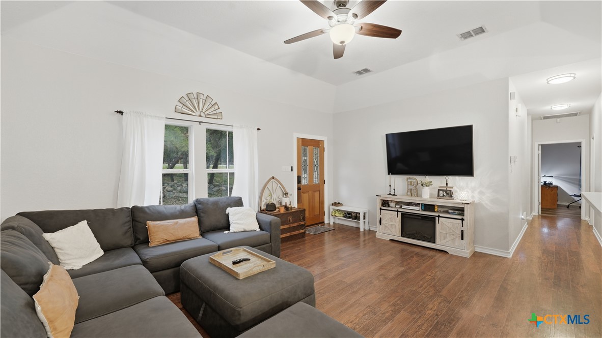 2216 Hornsby Spring Branch, TX 78070 - Photo 2 of 33 a living room with furniture and a flat screen tv