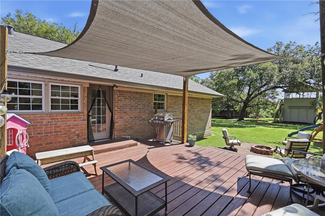 515 Crescent Drive Bryan, TX 77801 - Photo 34 of 43 Expansive wood-finish deck with a sunshade canopy