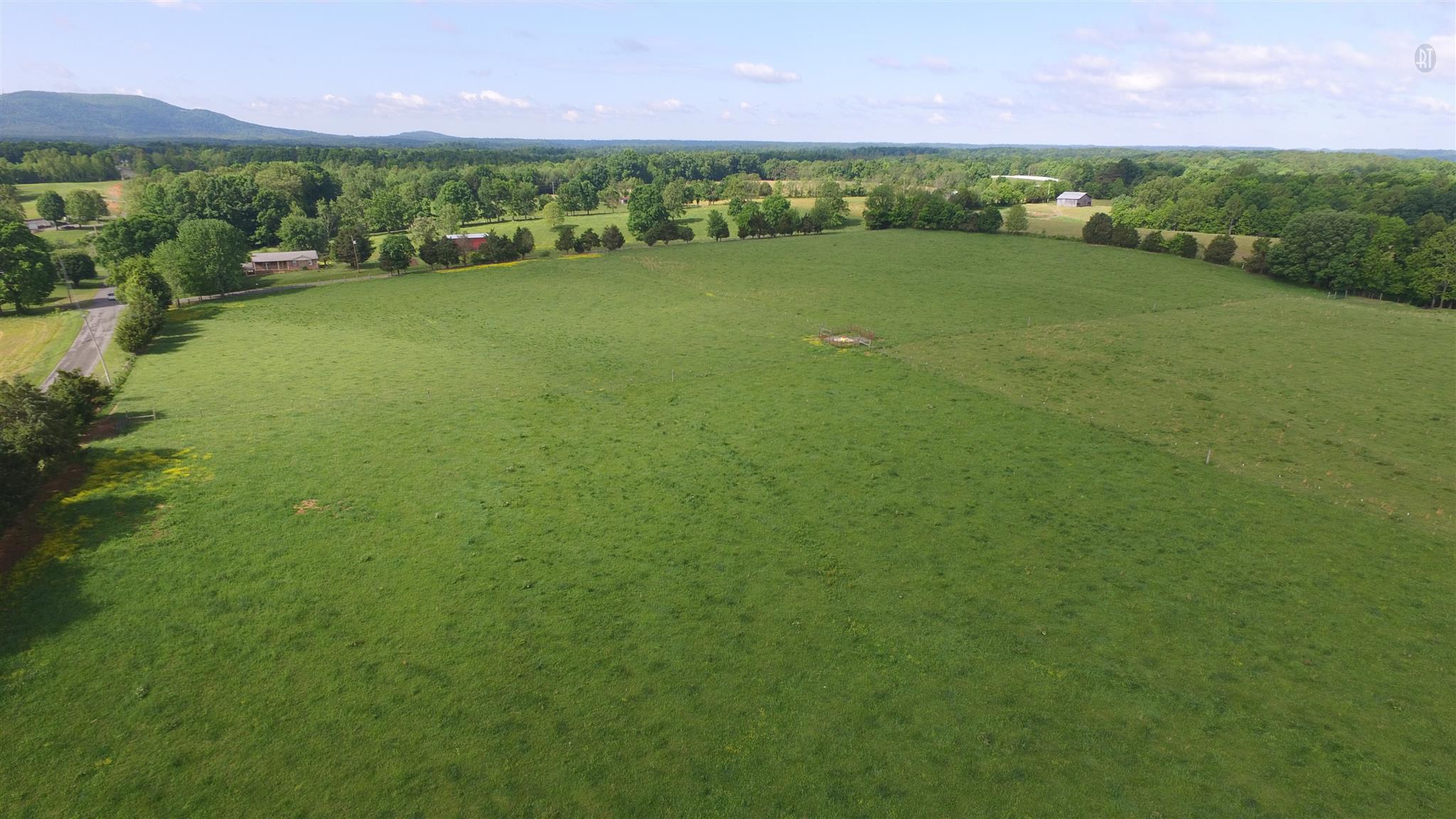 1 Pea Ridge Road Liberty, TN 37095 - Photo 2 of 6 a view of a green field with houses in the background