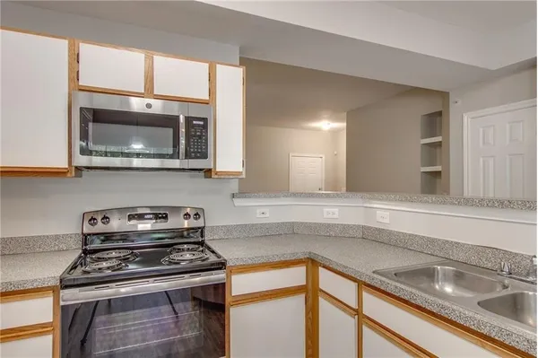 a kitchen with a stove and a microwave