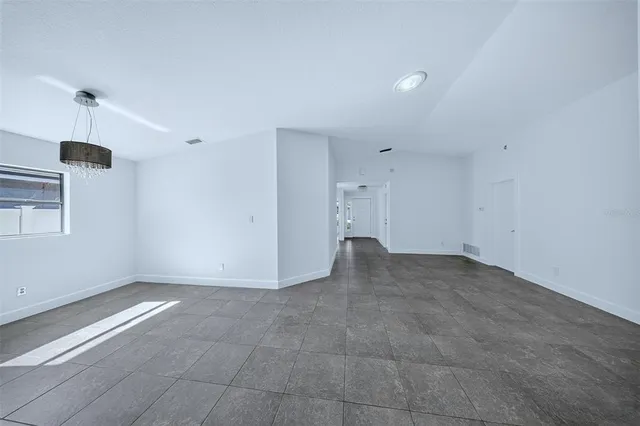 a bathroom with a granite countertop sink mirror vanity and toilet