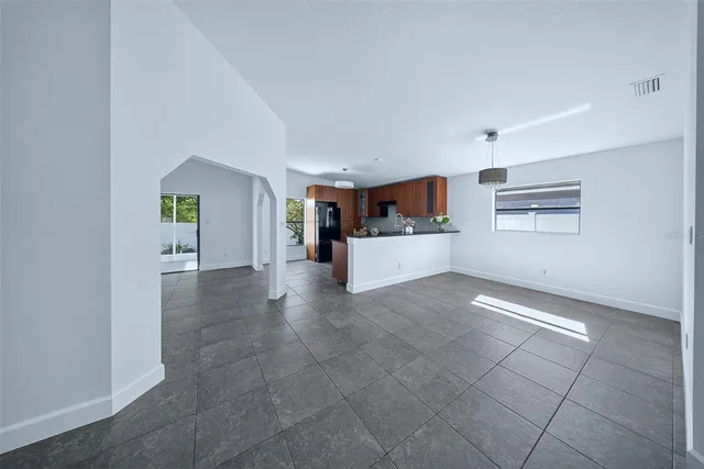 a view of a hallway with wooden floor and a fireplace