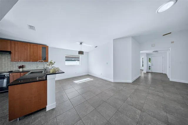 a backyard of a house with large trees