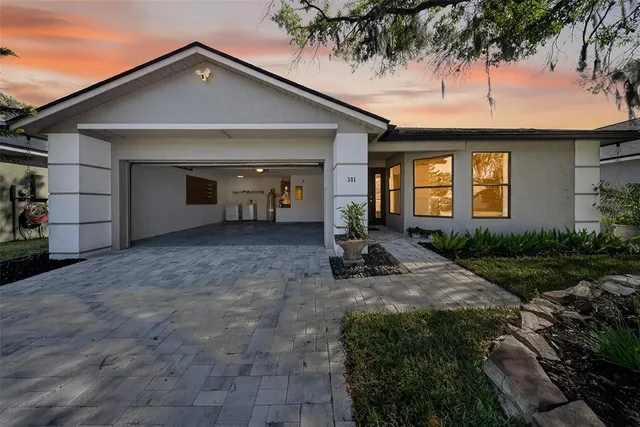 a living room with a sink dining table and chairs