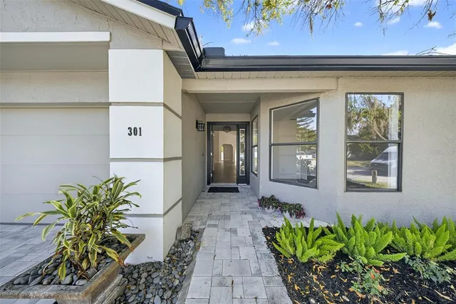 a kitchen with granite countertop a sink and cabinets
