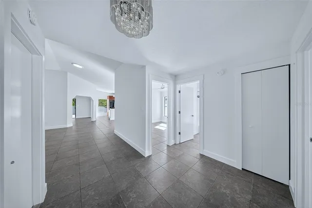a kitchen with granite countertop a sink and a stove top oven
