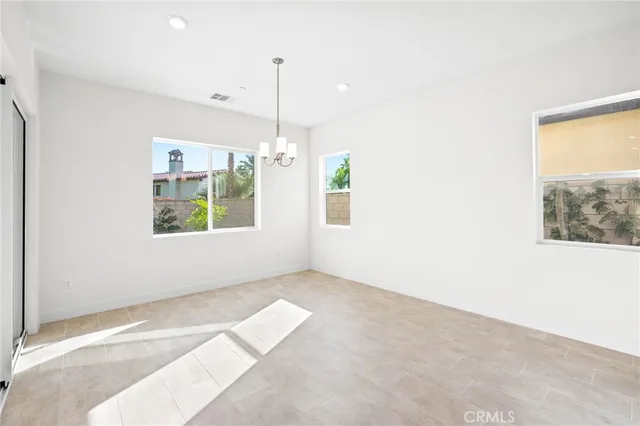 a view of an empty room with window and outdoor view