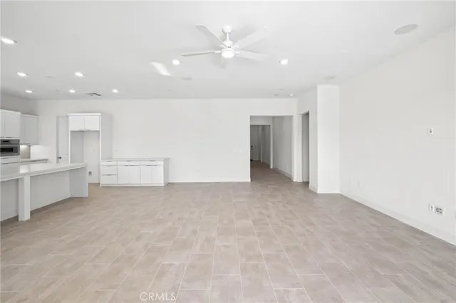 a view of a kitchen with a sink and cabinets