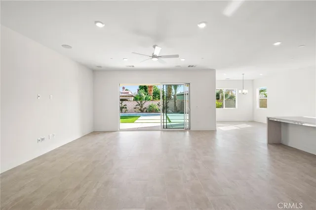 an empty room with window and outdoor view