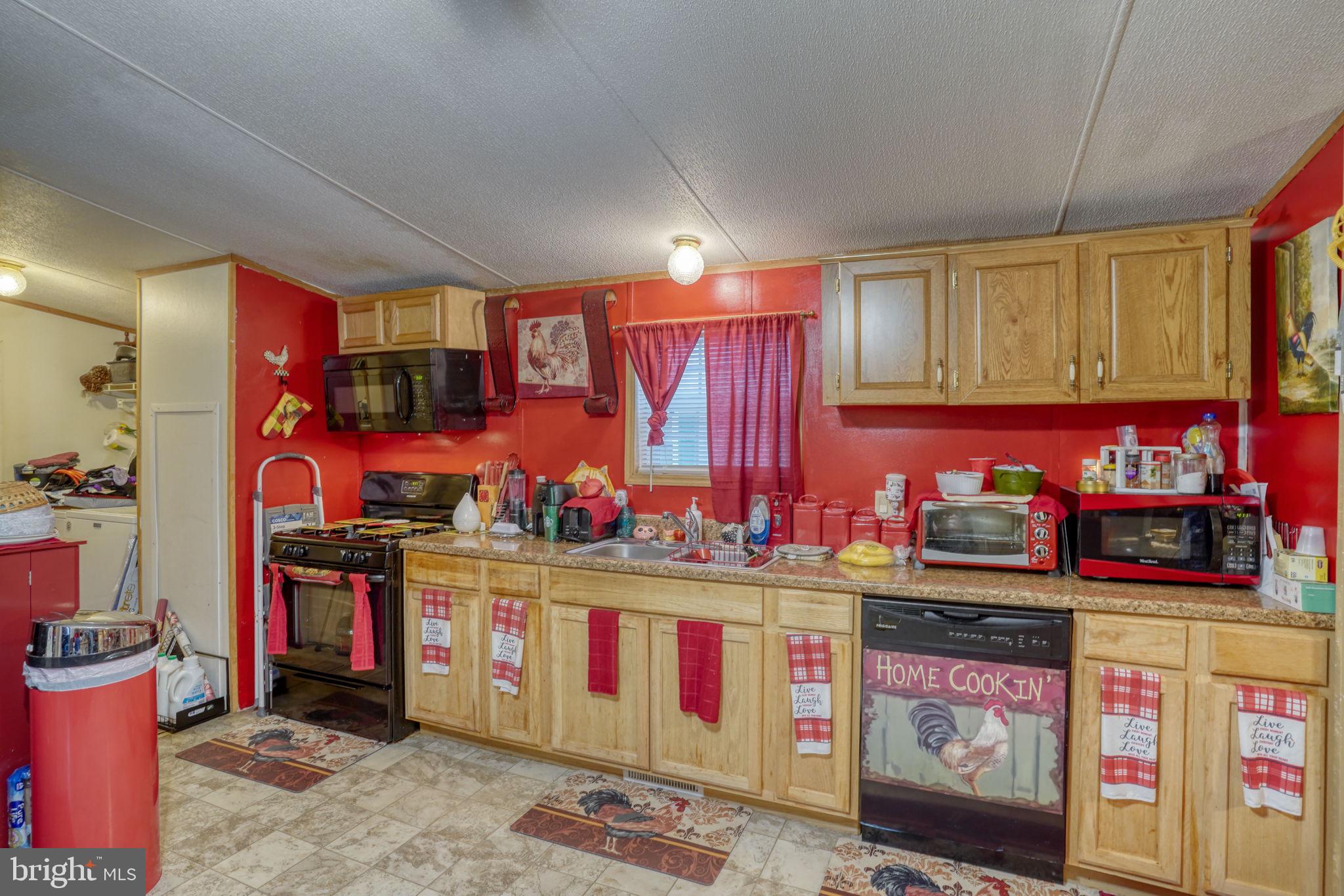 376 Graham Branch Road Seaford, DE 19973 - Photo 15 of 38 a kitchen with stainless steel appliances granite countertop a stove and cabinets