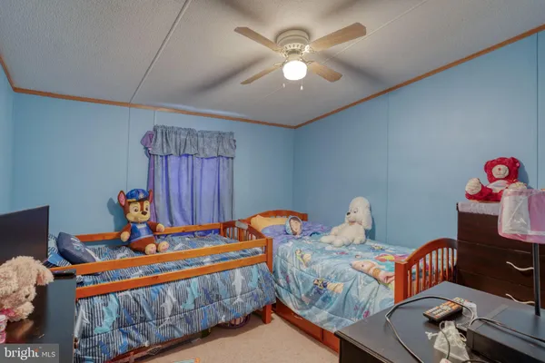 a bedroom with furniture and a chandelier