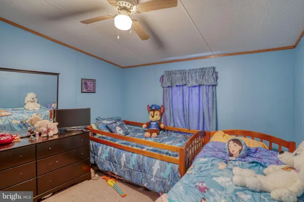 a bedroom with furniture and a bed