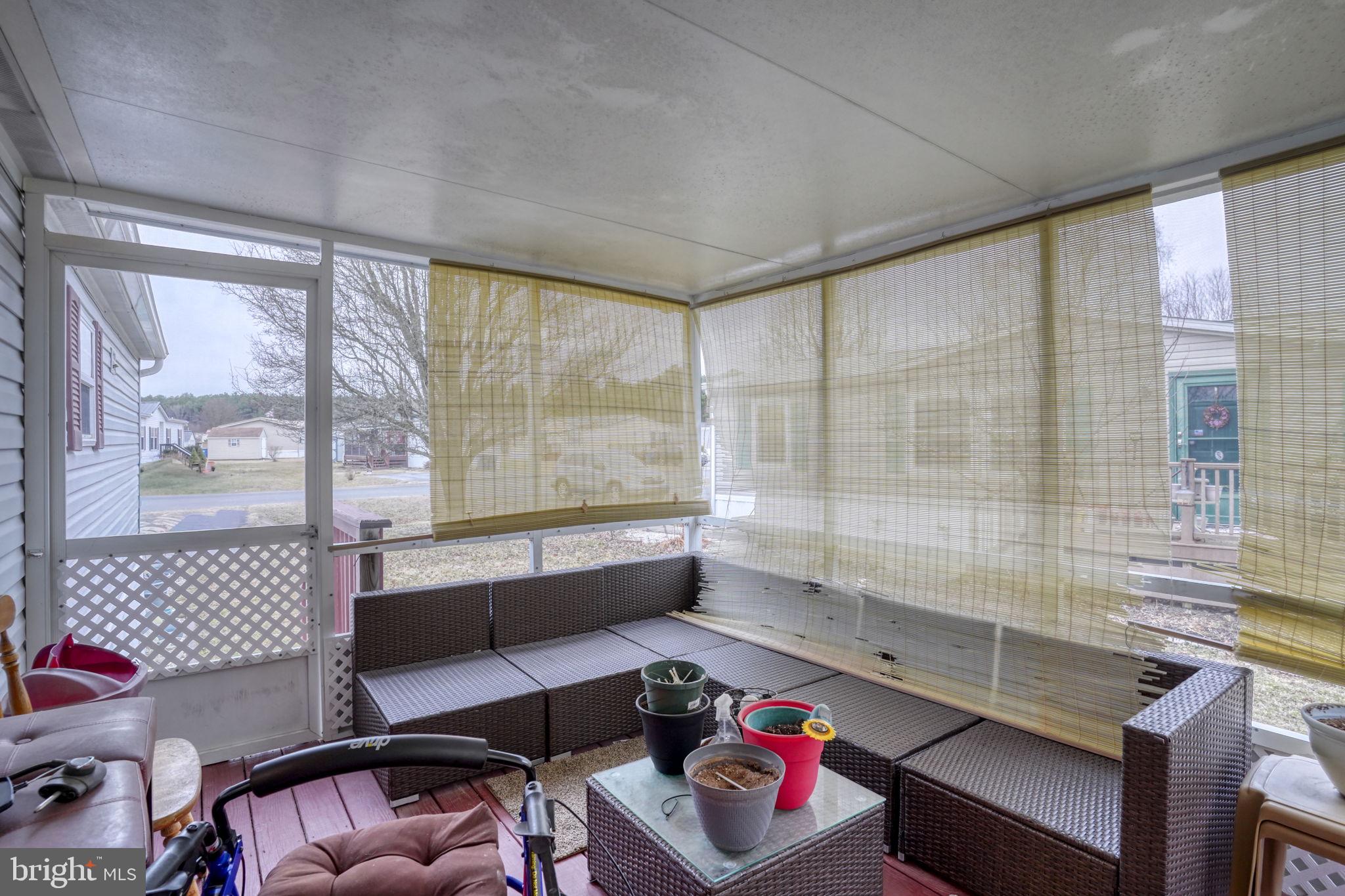 376 Graham Branch Road Seaford, DE 19973 - Photo 27 of 38 a living room with furniture and a floor to ceiling window
