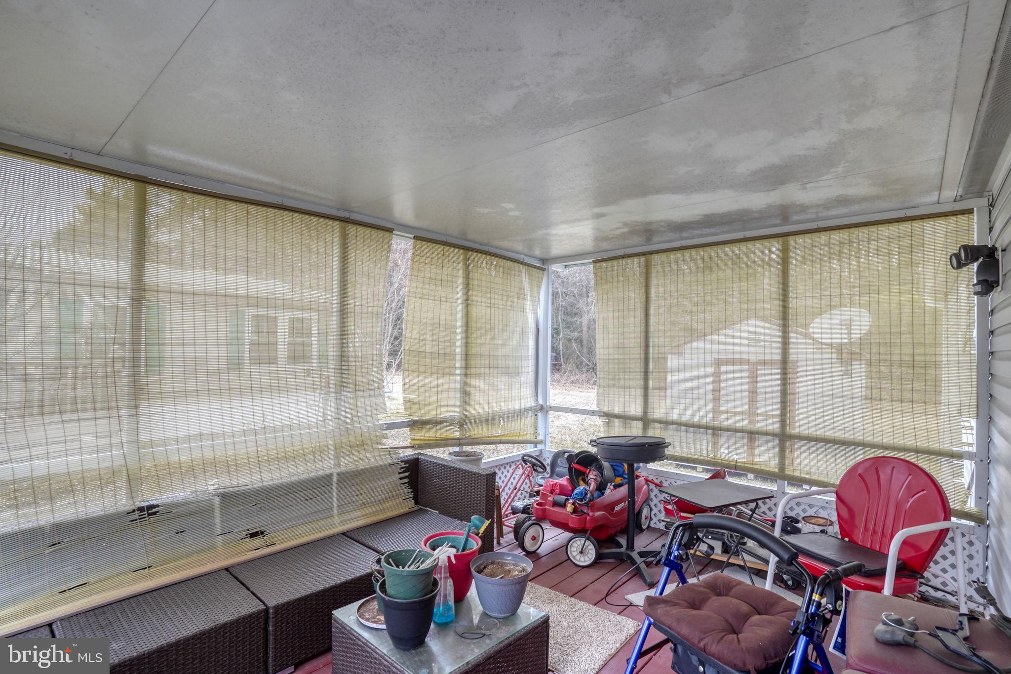 376 Graham Branch Road Seaford, DE 19973 - Photo 28 of 38 a living room with furniture and a floor to ceiling window