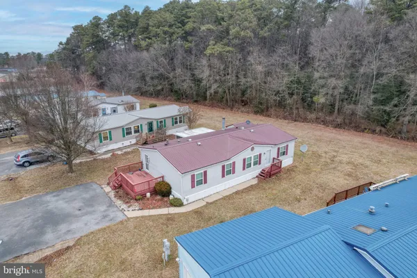 an aerial view of a house with roof deck
