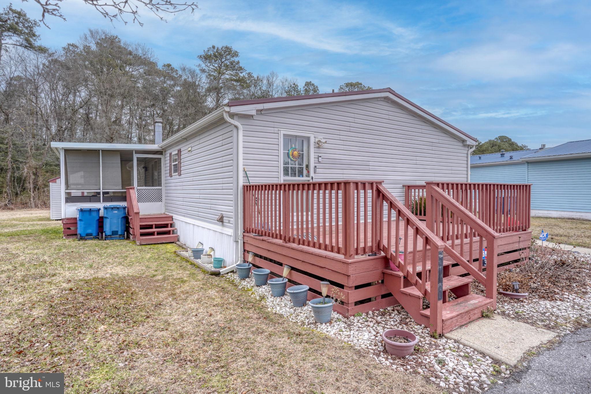 376 Graham Branch Road Seaford, DE 19973 - Photo 31 of 38 a view of a house with a yard and deck