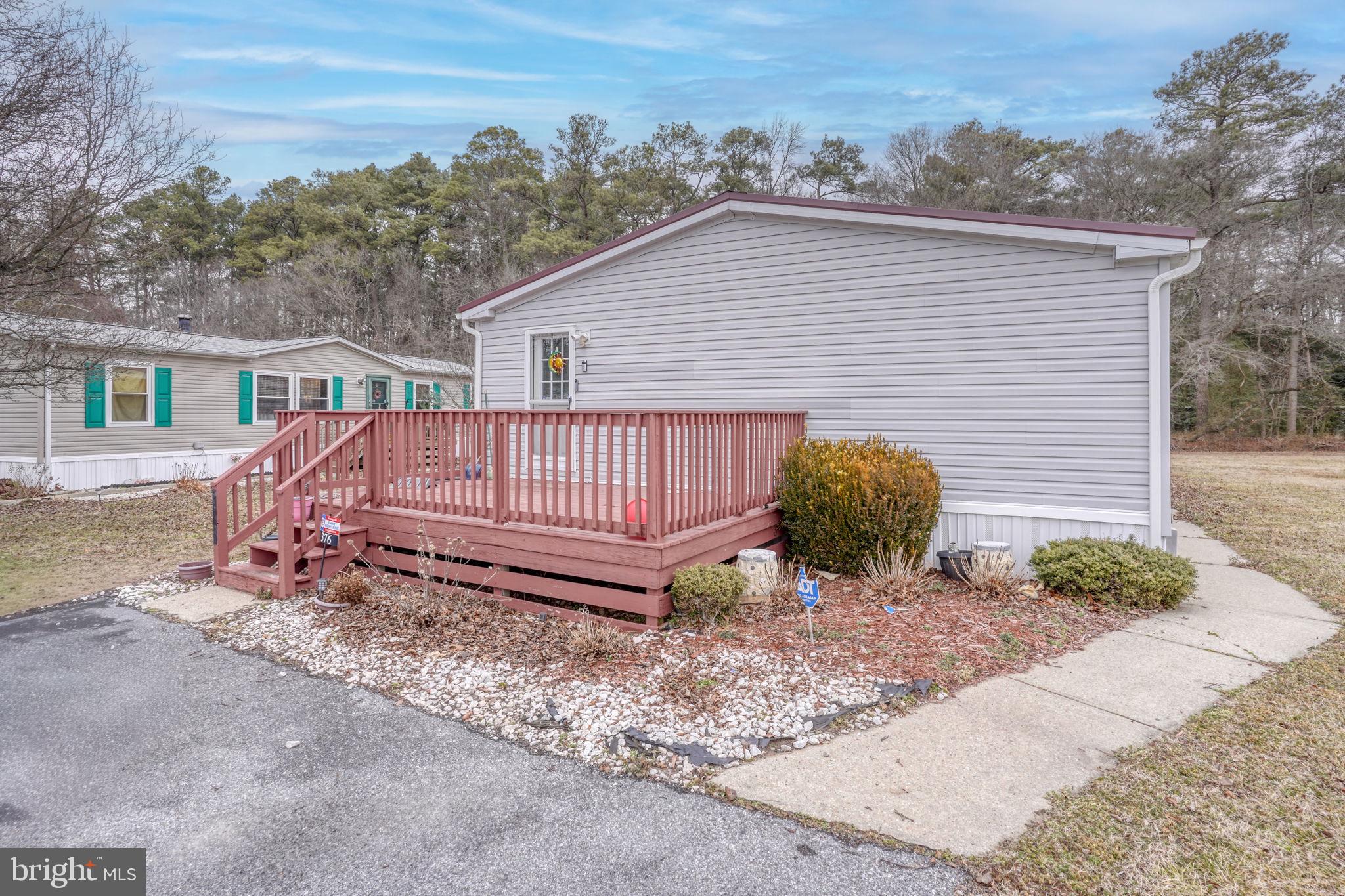 376 Graham Branch Road Seaford, DE 19973 - Photo 32 of 38 a view of a backyard with a small cabin