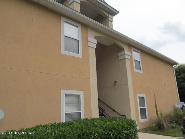 3641 Kirkpatrick Circle, Unit 1 Jacksonville, FL 32210 - Photo 1 of 11 a front view of a house with garage