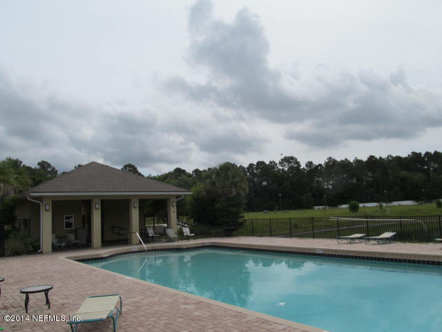 3641 Kirkpatrick Circle, Unit 1 Jacksonville, FL 32210 - Photo 11 of 11 a view of a house with a yard and a fountain