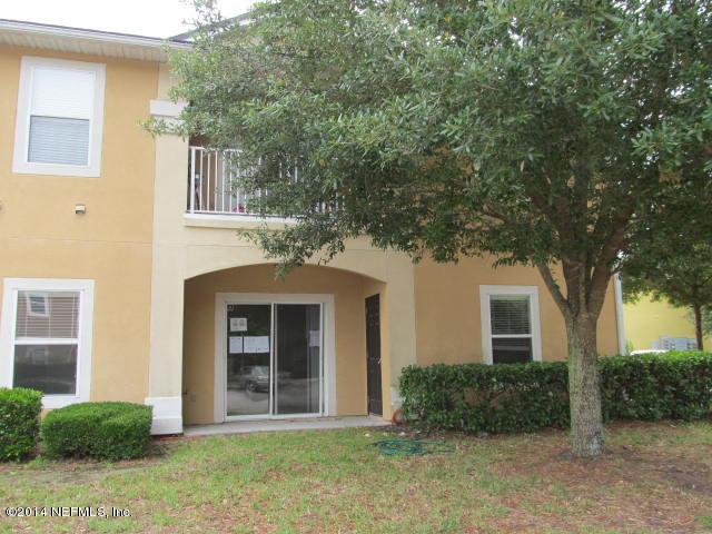 3641 Kirkpatrick Circle, Unit 1 Jacksonville, FL 32210 - Photo 2 of 11 a front view of a house with garden
