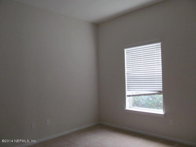 3641 Kirkpatrick Circle, Unit 1 Jacksonville, FL 32210 - Photo 6 of 11 a view of an empty room and window