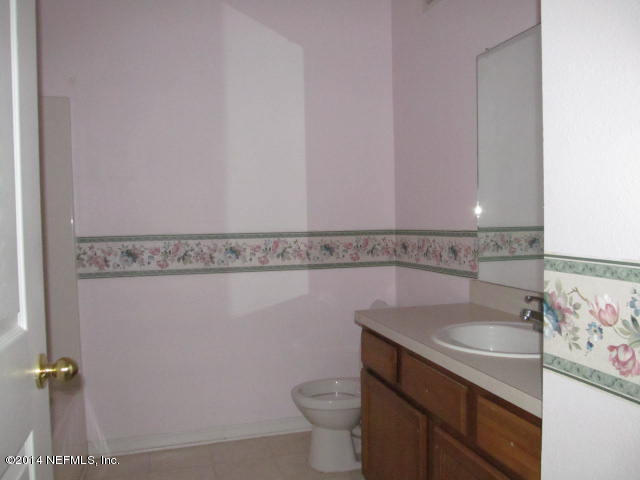 3641 Kirkpatrick Circle, Unit 1 Jacksonville, FL 32210 - Photo 7 of 11 a bathroom with a sink and a toilet