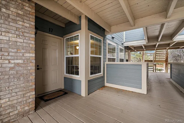 a view of porch with wooden floor
