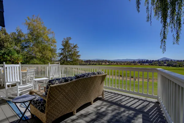 a view of hallway with stairs and wooden floor