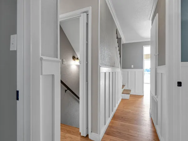 a view of cabinets and wooden floor