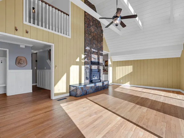 a view of a house with a yard and garage