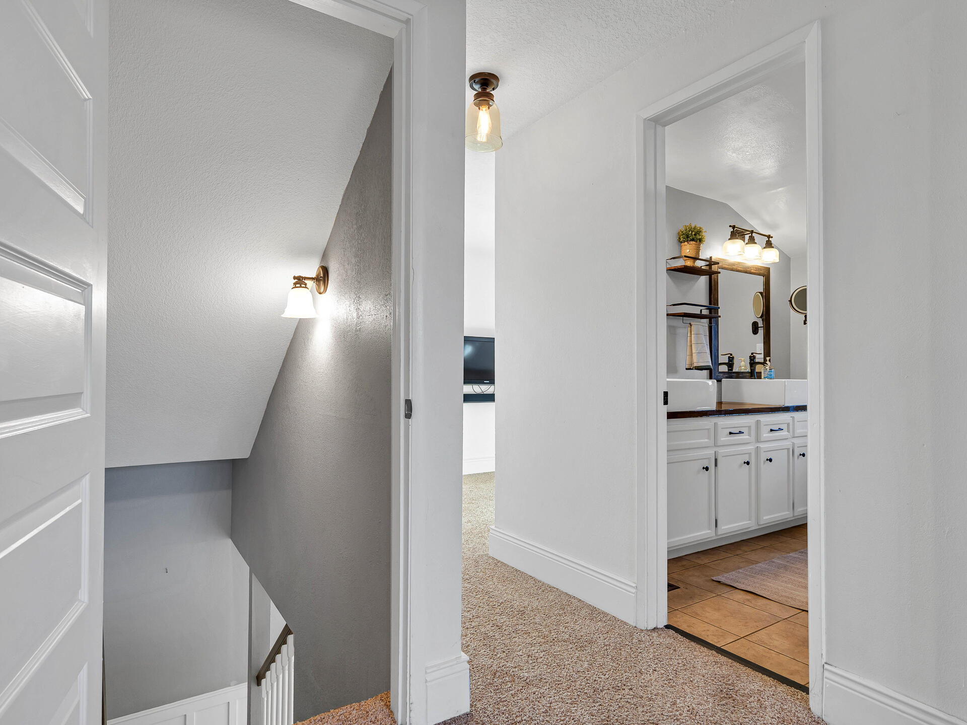 45833 Pittville Road McArthur, CA 96056 - Photo 37 of 81 a view of hallway with stairs and wooden floor
