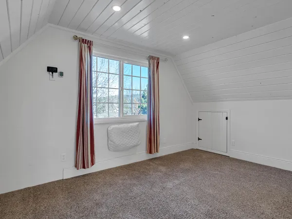 an aerial view of a house with outdoor space