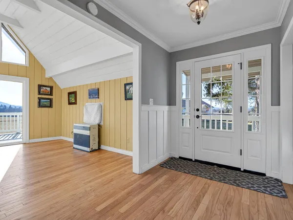 a kitchen with granite countertop a sink and cabinets