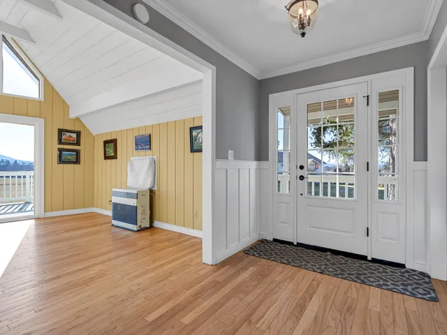 a kitchen with granite countertop a sink and cabinets