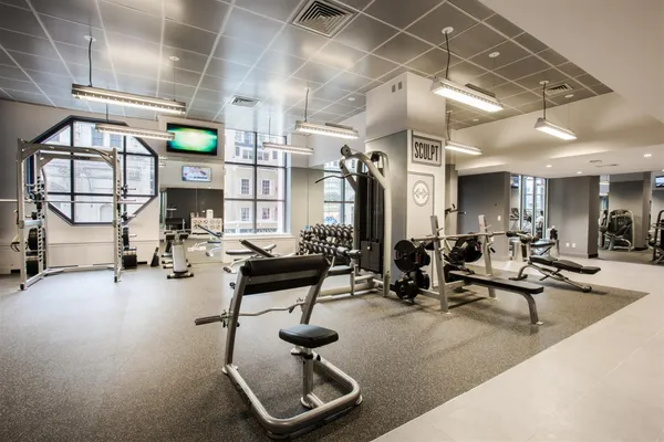 a gym room with lots of gym equipment