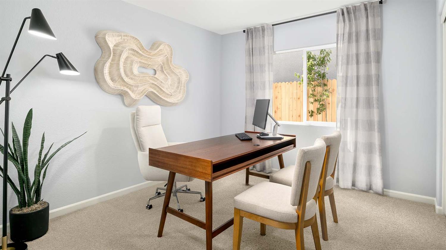 1657 Pacific Drive Los Banos, CA 93635 - Photo 8 of 10 a view of a room that has a table and a chair in it