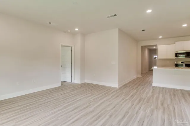 a view of kitchen with wooden floor