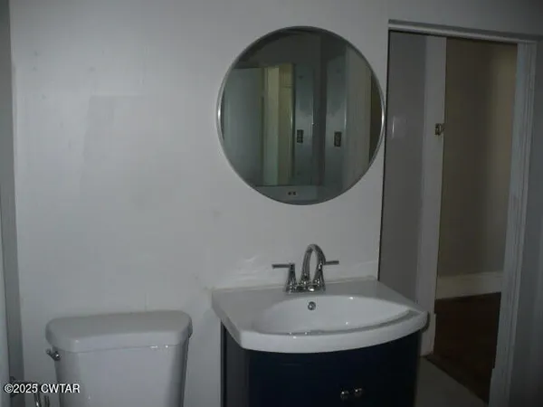 a bathroom with a sink and mirror