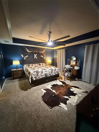 a bedroom with bed and window