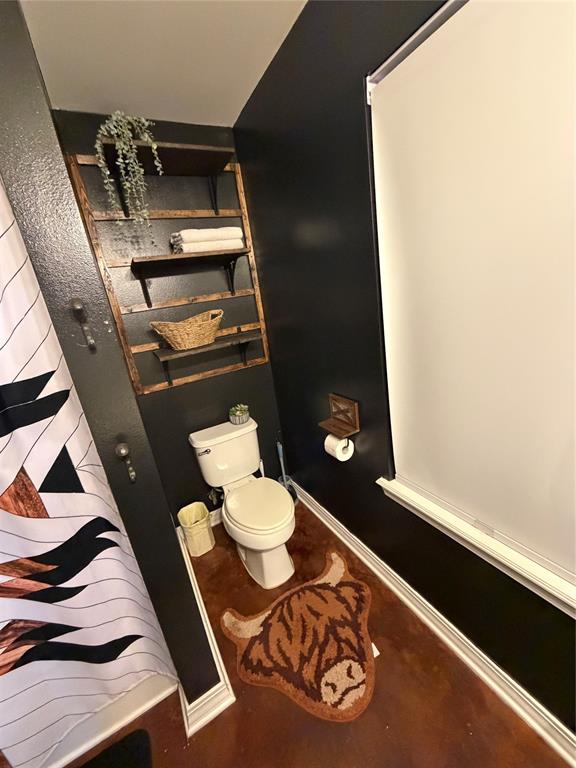 128 Staton Drive Haughton, LA 71037 - Photo 17 of 29 a bathroom with a toilet and a mirror