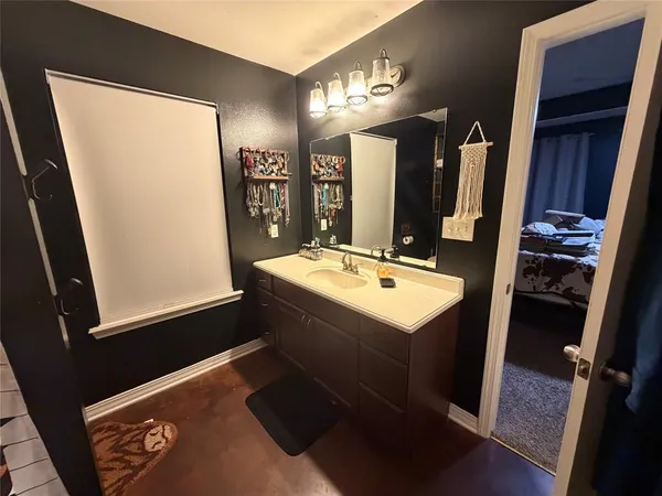 a room with lots of appliances and cabinets