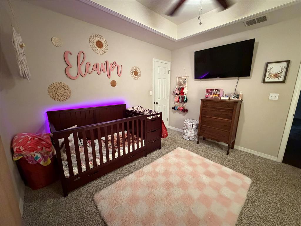 128 Staton Drive Haughton, LA 71037 - Photo 21 of 29 a bedroom with a bed and a flat screen tv