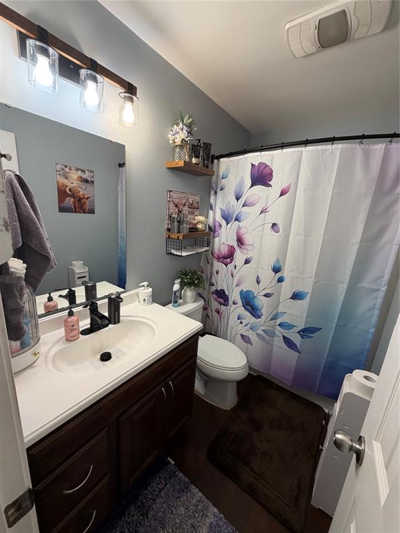 128 Staton Drive Haughton, LA 71037 - Photo 23 of 29 a bathroom with a sink mirror vanity and toilet