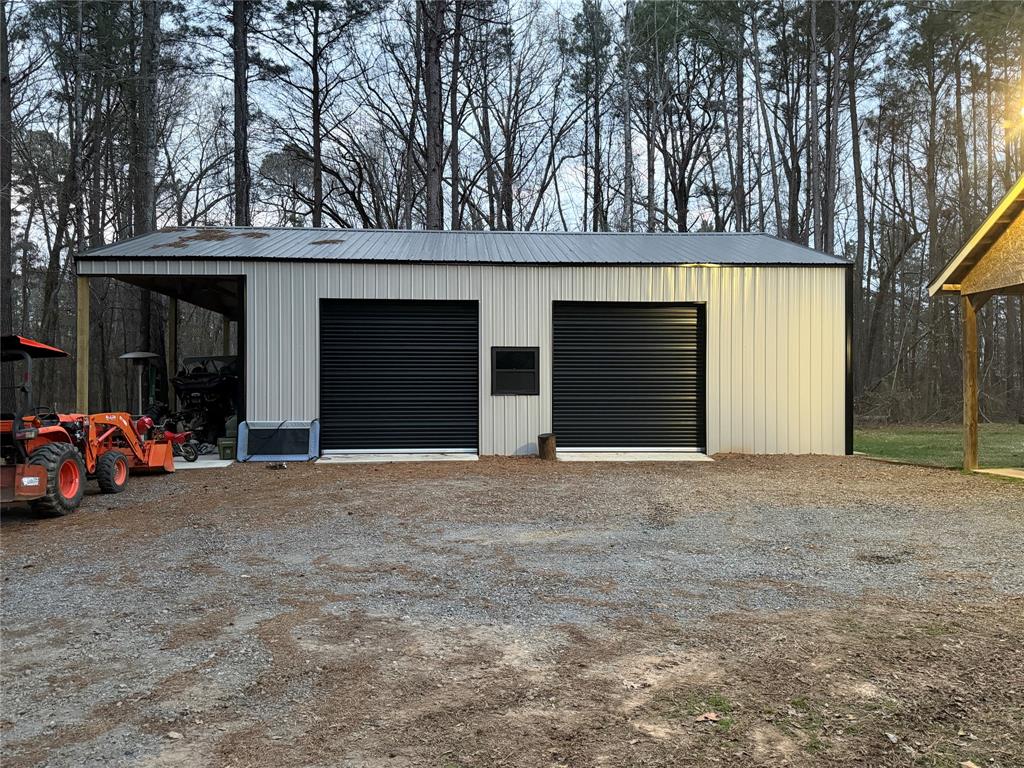128 Staton Drive Haughton, LA 71037 - Photo 7 of 29 a view of outdoor space and garage