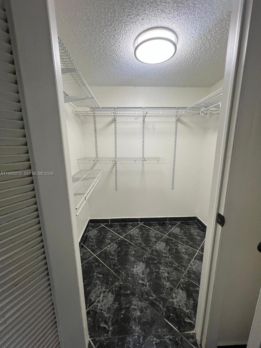 1900 West 68th Street, Unit D207 Hialeah, FL 33014 - Photo 19 of 33 a view of walk in closet