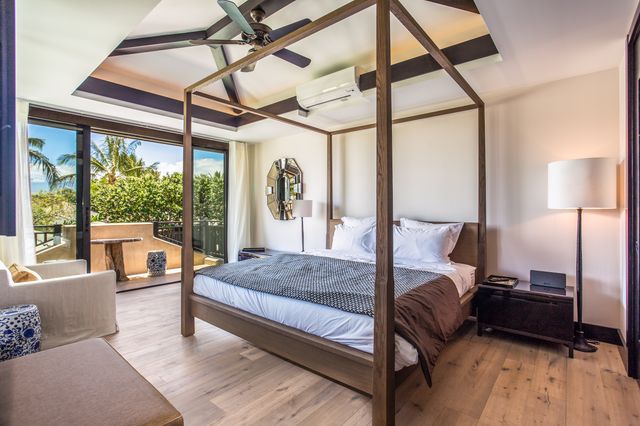 a bedroom with a bed window and a walk in closet