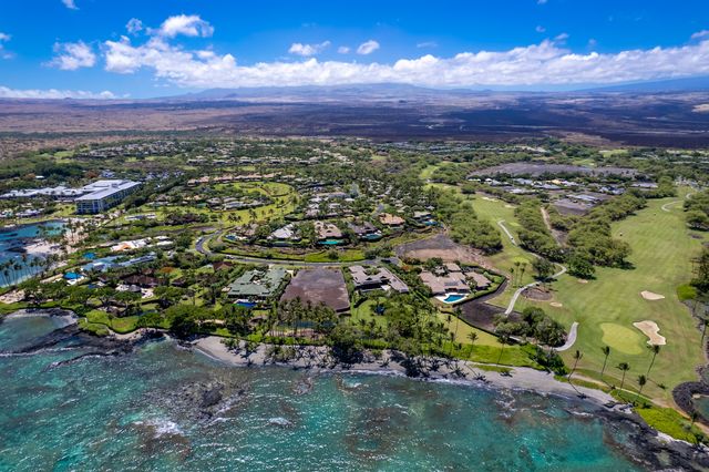 a view of a city with mountains in the background